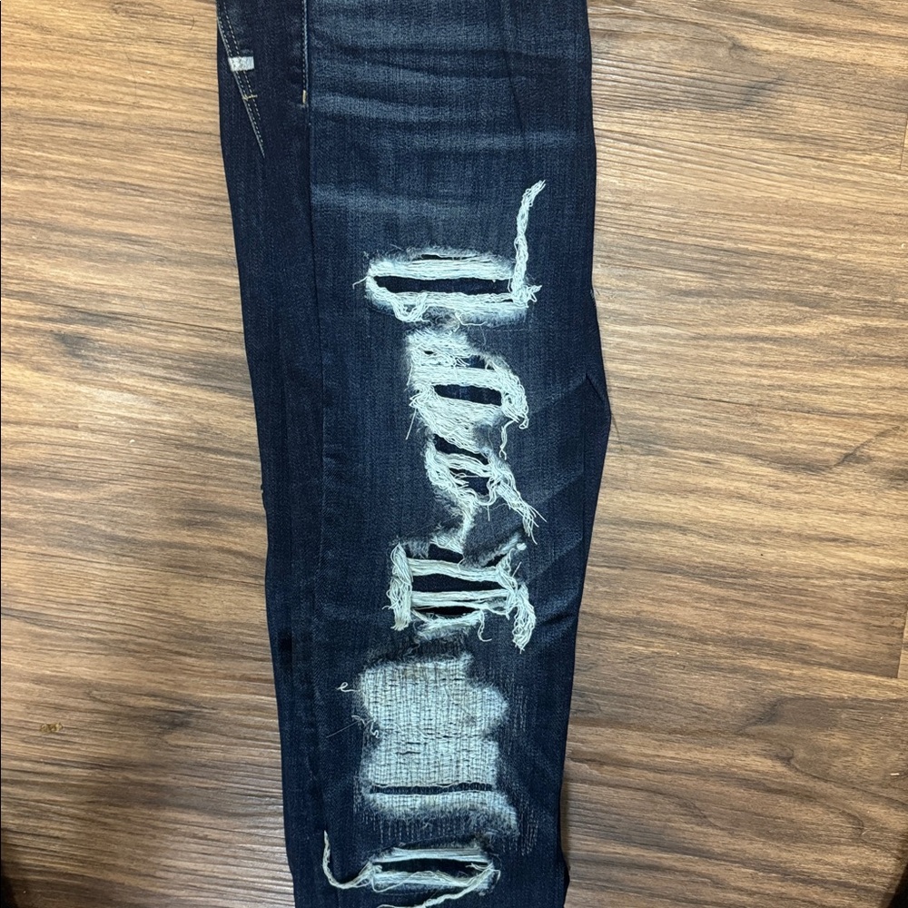 Distressed Dark Blue Jeans